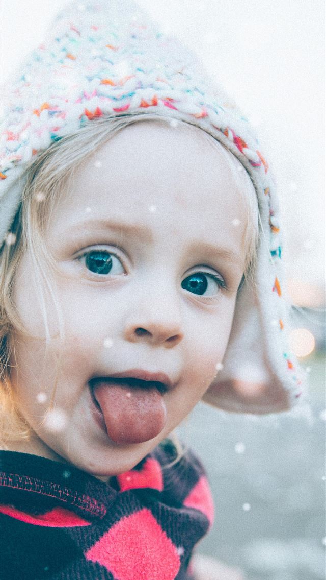 1290x2796 girl wearing knit cap and showing her tongue - christmas iPhone Wallpaper