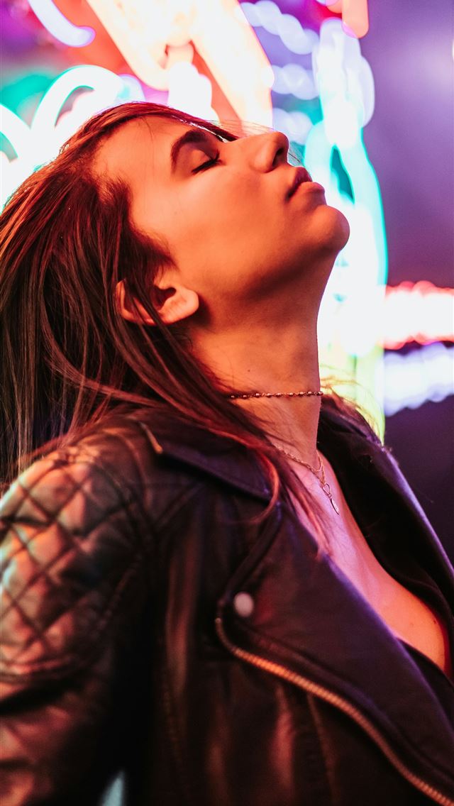 1290x2796 woman wearing black leather jacket standing near n... - christmas iPhone Wallpaper