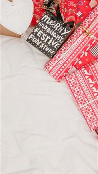 red and black packed presents on white textile wallpaper