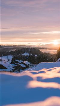 snow covered field during sunset wallpaper