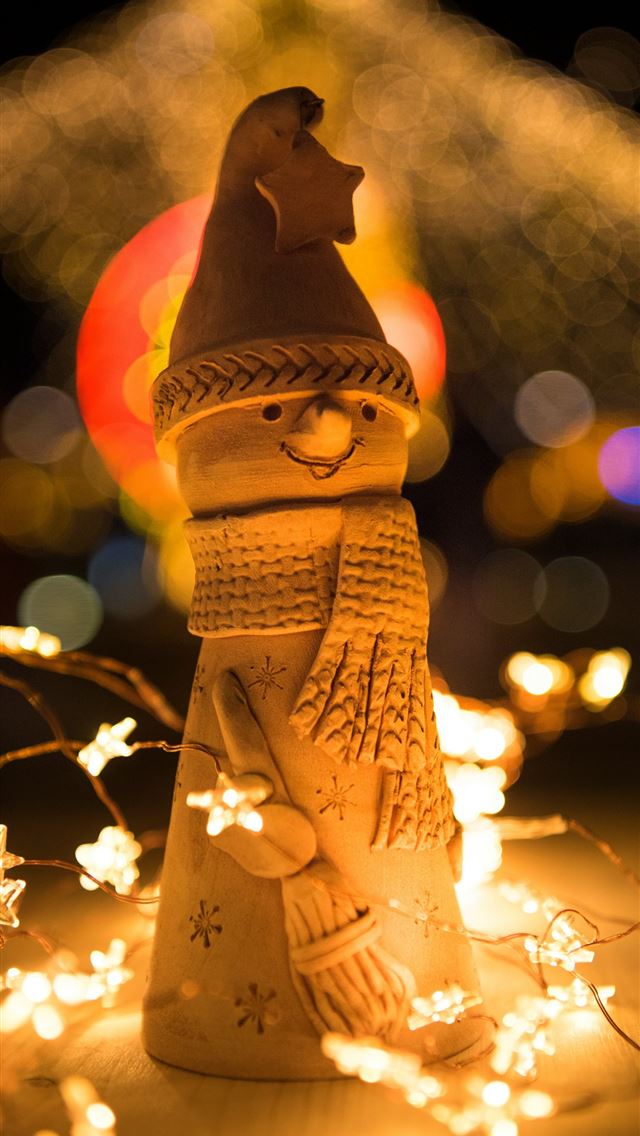 1290x2796 bokeh photography of snowman figurine - lights iPhone Wallpaper
