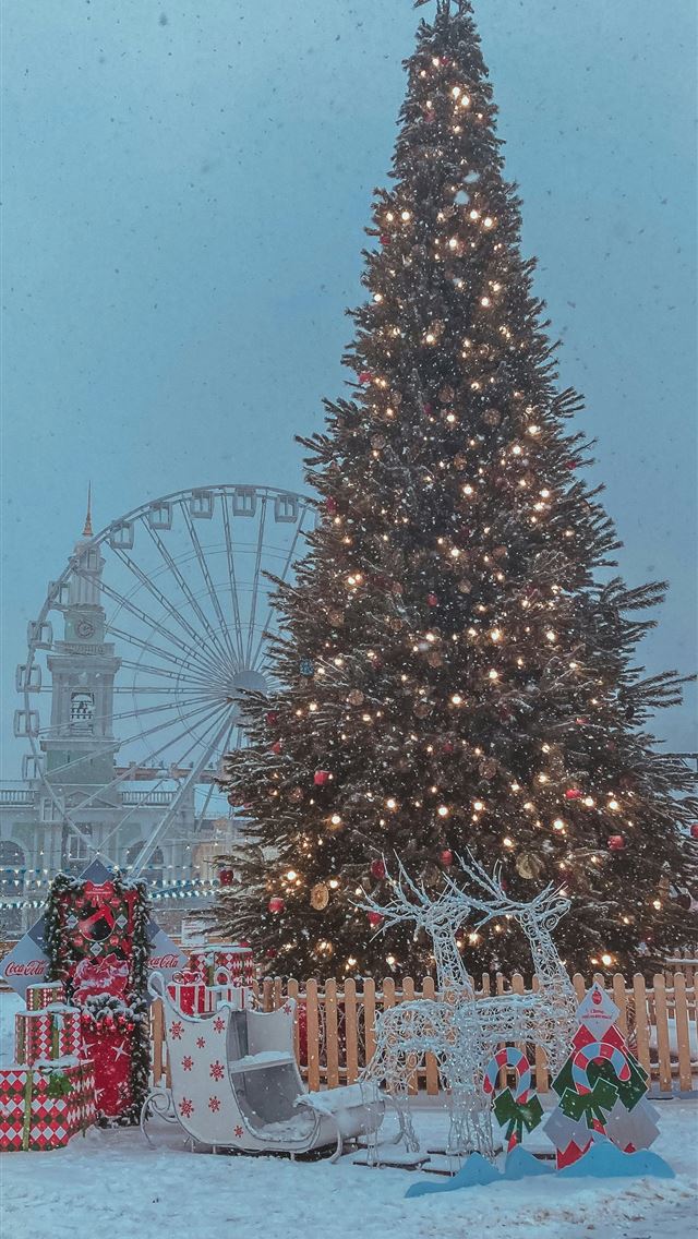 1290x2796 christmas tree with string lights and baubles near... - toys iPhone Wallpaper