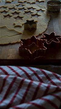 assorted shape gray molds beside dough on chopping... wallpaper