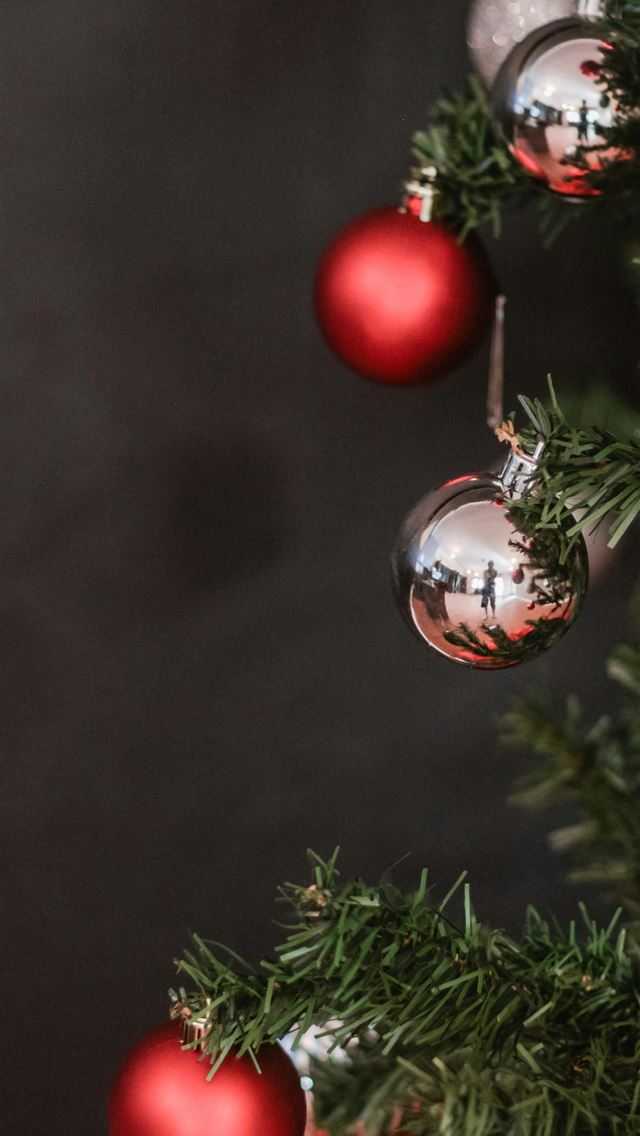 1290x2796 Christmas bauble hanging on Christmas tree - love iPhone Wallpaper