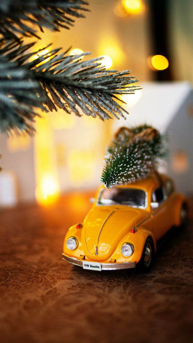 1290x2796 yellow volkswagen beetle parked beside green palm ... -  iphone 15 Wallpaper