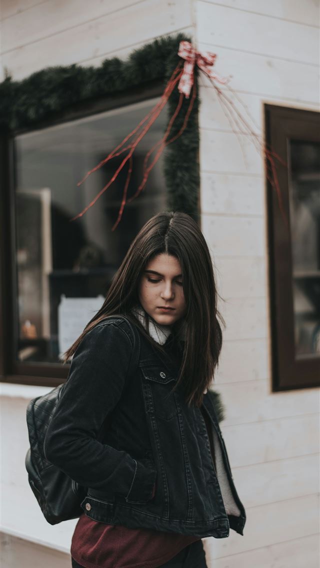 1290x2796 woman standing near store during daytime - christmas iPhone Wallpaper