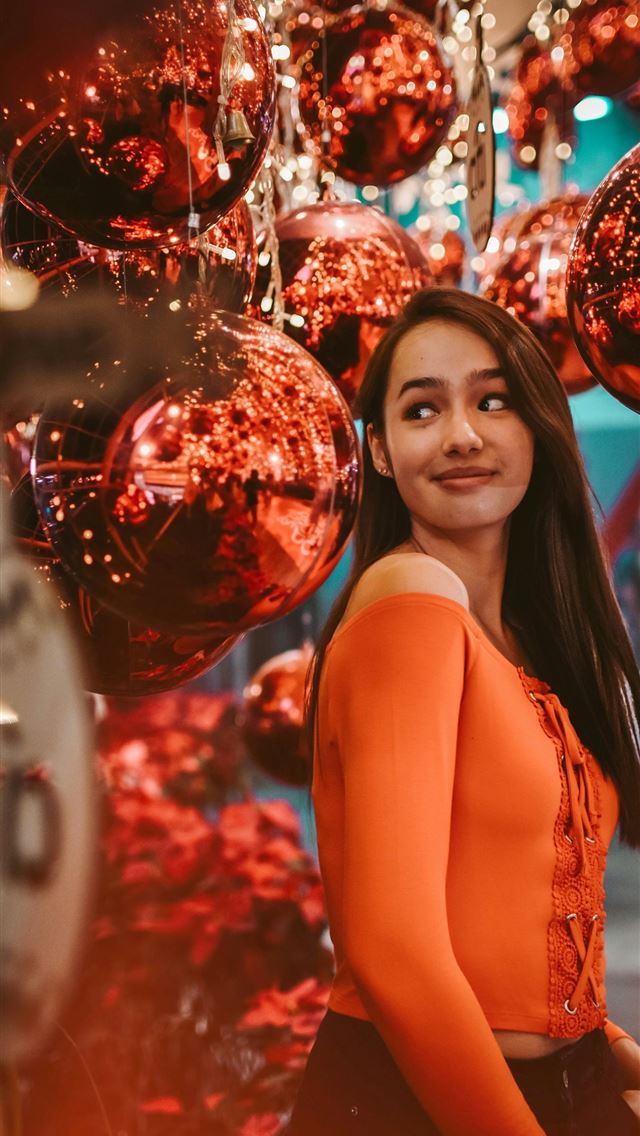 1290x2796 woman wearing orange top - holiday iPhone Wallpaper