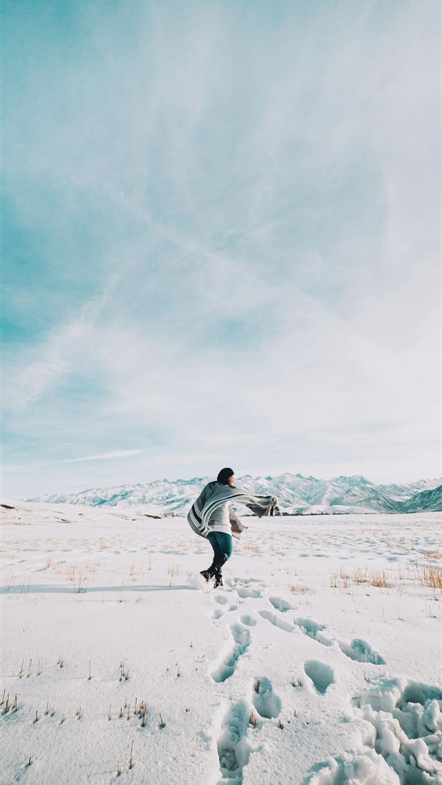 1290x2796 person in white jacket and black pants walking on ... - sky iPhone Wallpaper