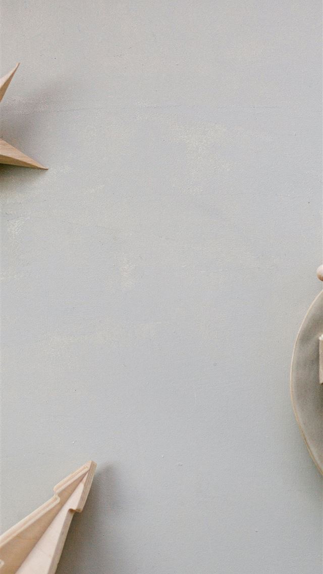 1290x2796 a white plate topped with a wooden beaded necklace - grey iPhone Wallpaper