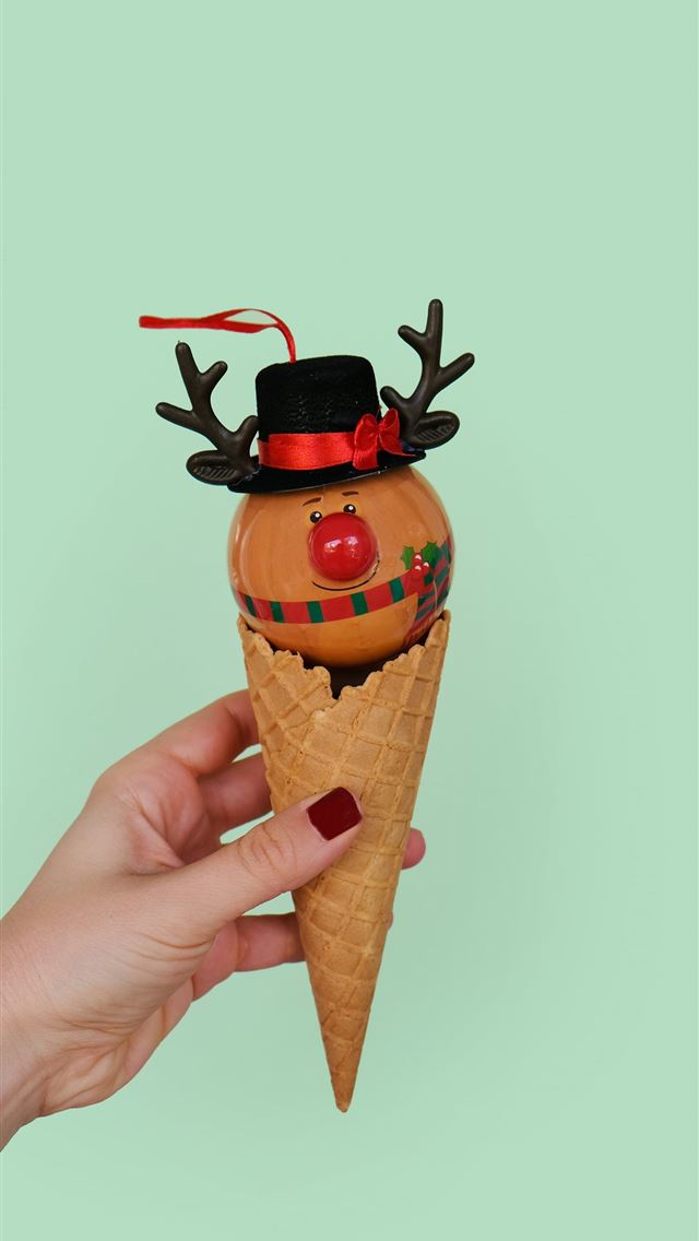 1290x2796 person holding cone with scarecrow - holiday iPhone Wallpaper