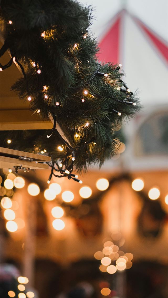 1290x2796 a close up of a building with lights on it -  iphone 15 Wallpaper