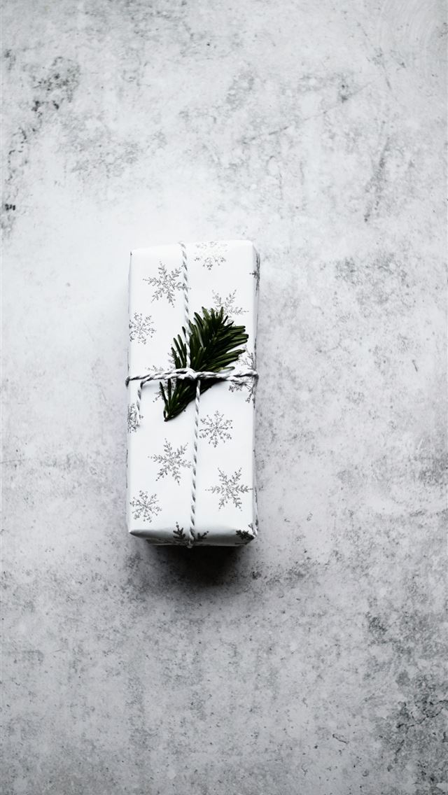 1290x2796 white and black snowflake print gift box on gray s... -  iphone 15 Wallpaper