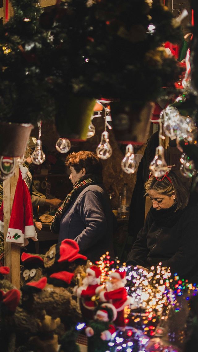 1290x2796 selective focus photo of woman standing inside sto... -  iphone 15 Wallpaper