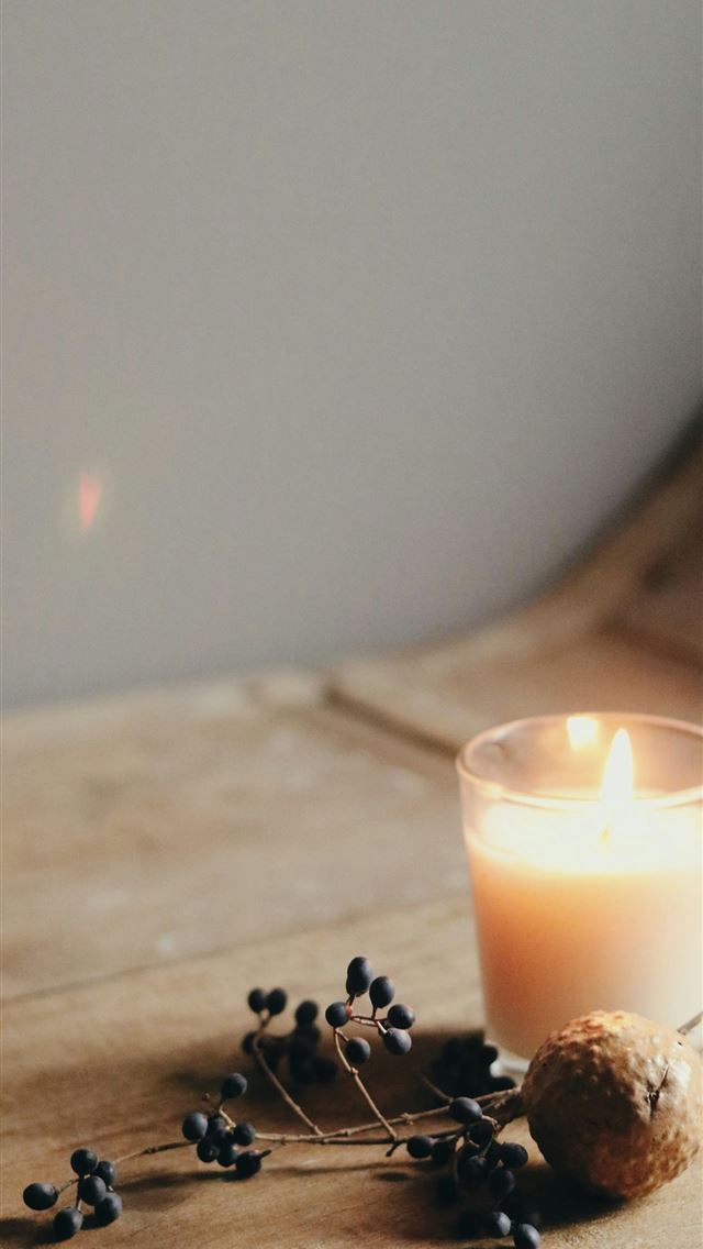 1290x2796 white candle on brown wooden table - holiday iPhone Wallpaper
