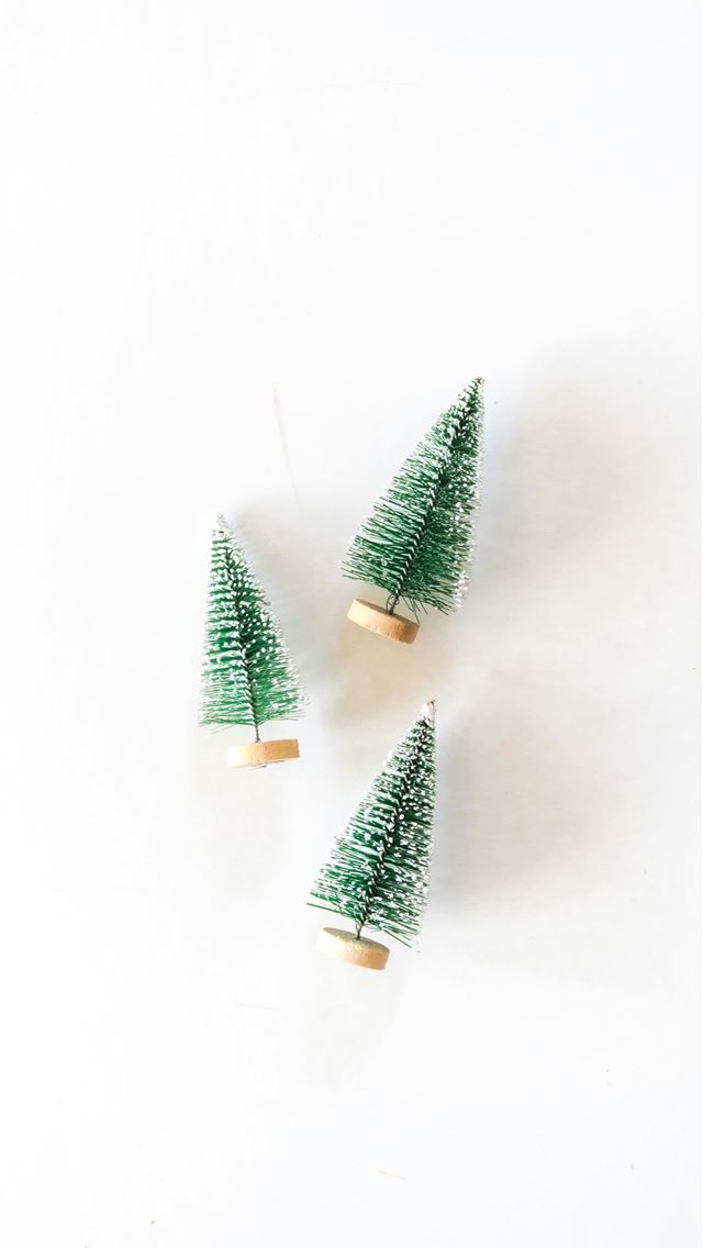 1290x2796 three pine tree miniatures on white surface -  iphone 15 Wallpaper