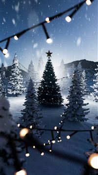 a snowy landscape with christmas trees and lights wallpaper