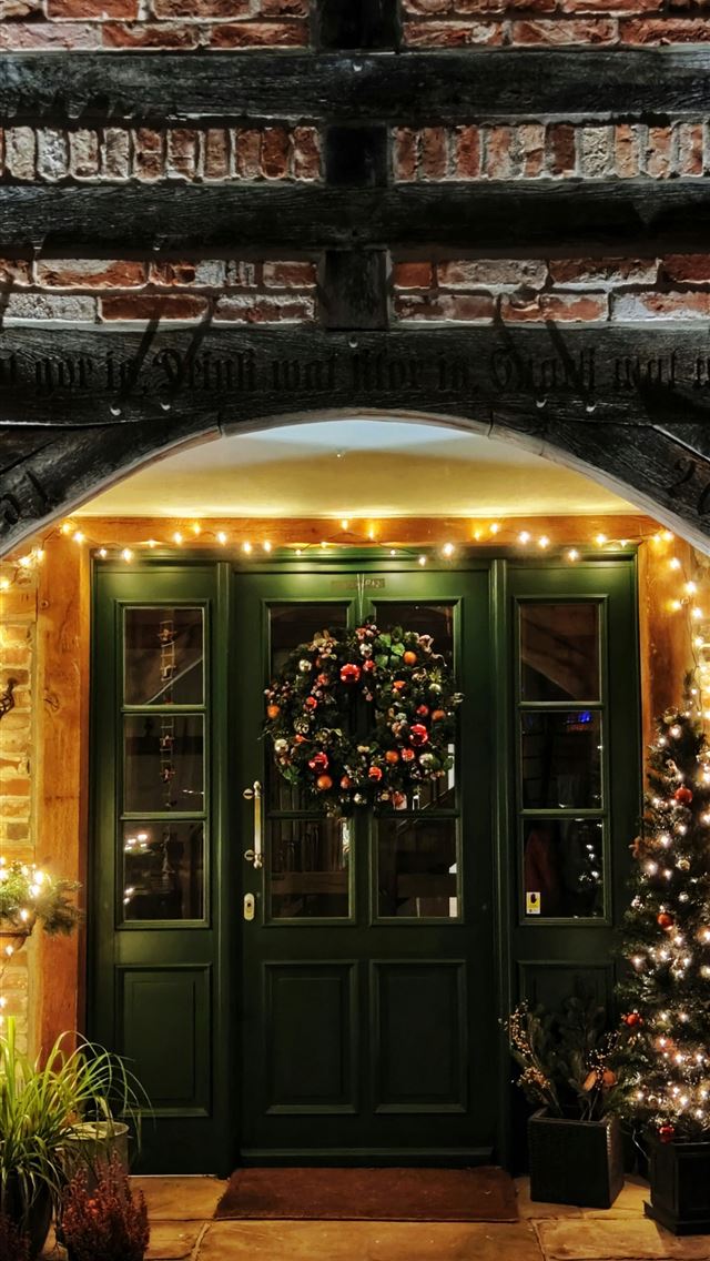 1290x2796 brown wooden door with light - christmas iPhone Wallpaper