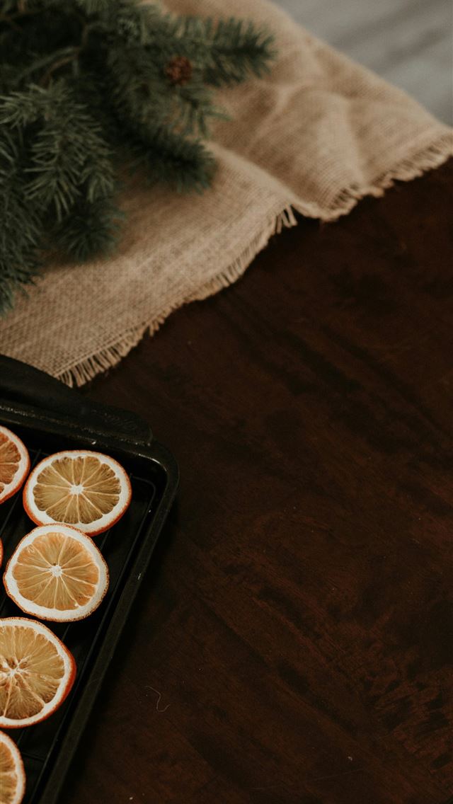 1290x2796 a tray of sliced oranges sitting on a table - fruit iPhone Wallpaper