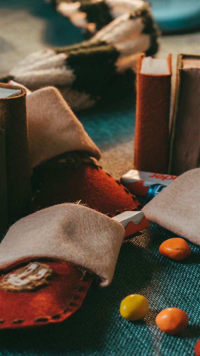 1290x2796 shallow focus photo of candies on blue textile - happy new year iPhone Wallpaper