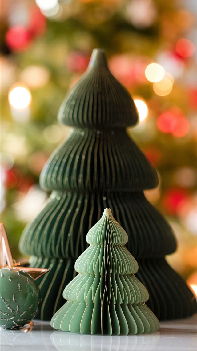 1290x2796 a close up of a small christmas tree on a table - tree iPhone Wallpaper