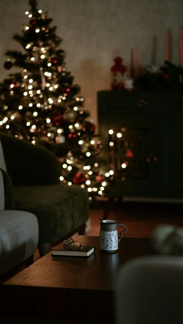 1290x2796 a living room with a christmas tree in the backgro... - holiday iPhone Wallpaper