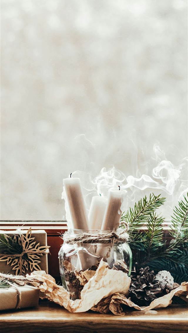 1290x2796 a window sill with a glass jar filled with candles - grey iPhone Wallpaper