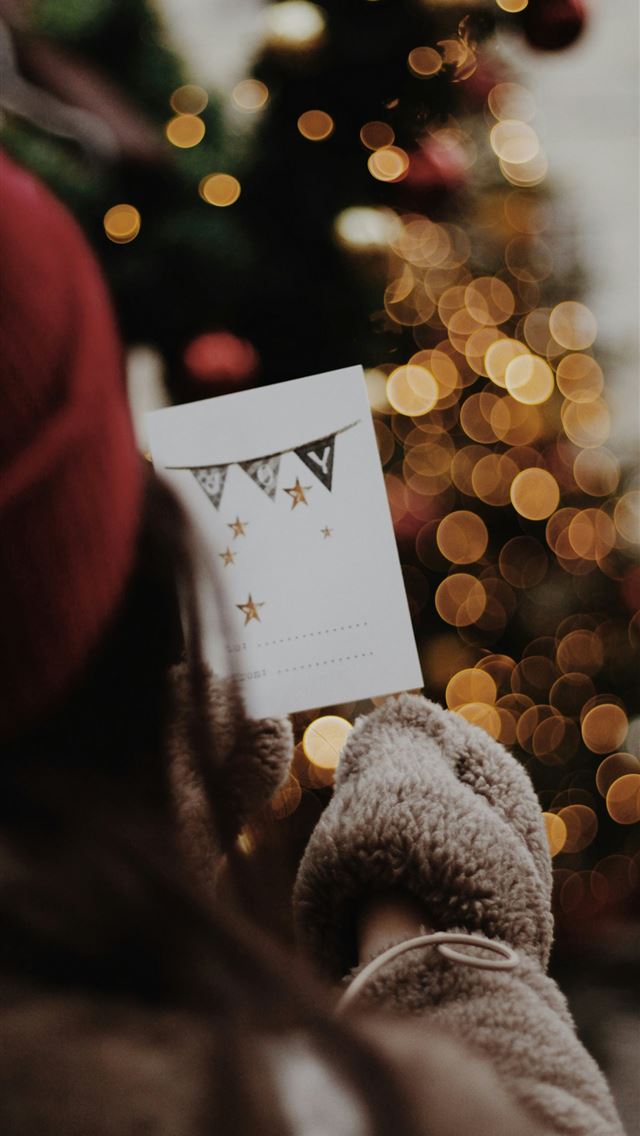 1290x2796 woman wearing gray sweater and red hat inside well... - christmas iPhone Wallpaper