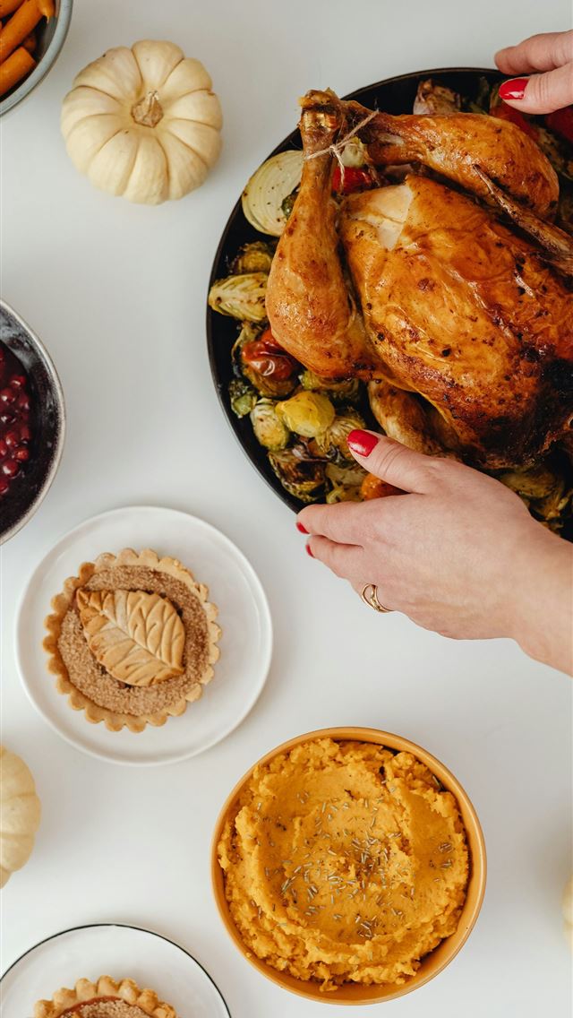 1290x2796 a person holding a plate of food - turkey iPhone Wallpaper