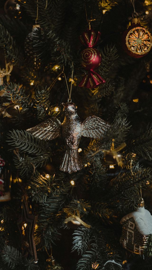1290x2796 a close up of a christmas tree with ornaments - christmas iPhone Wallpaper