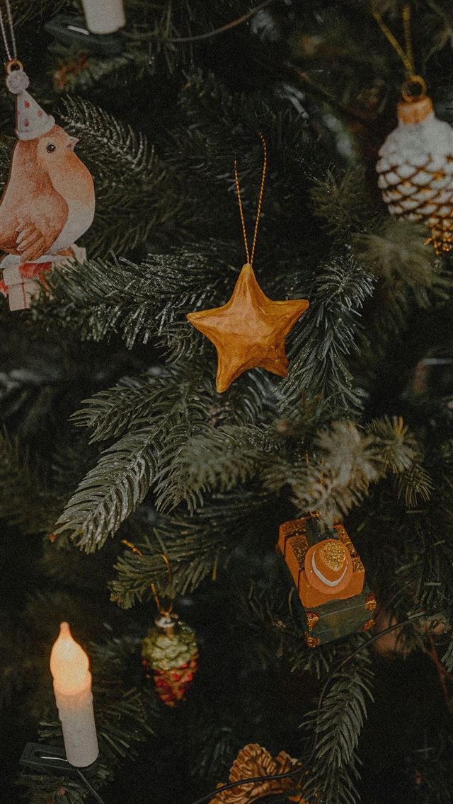 1290x2796 a close up of a christmas tree with ornaments on i... - christmas iPhone Wallpaper
