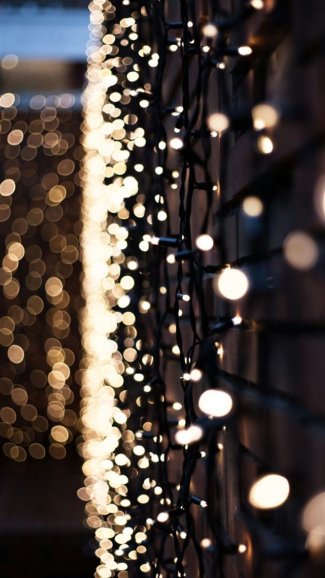 1290x2796 a bunch of lights that are on a wall - christmas iPhone Wallpaper