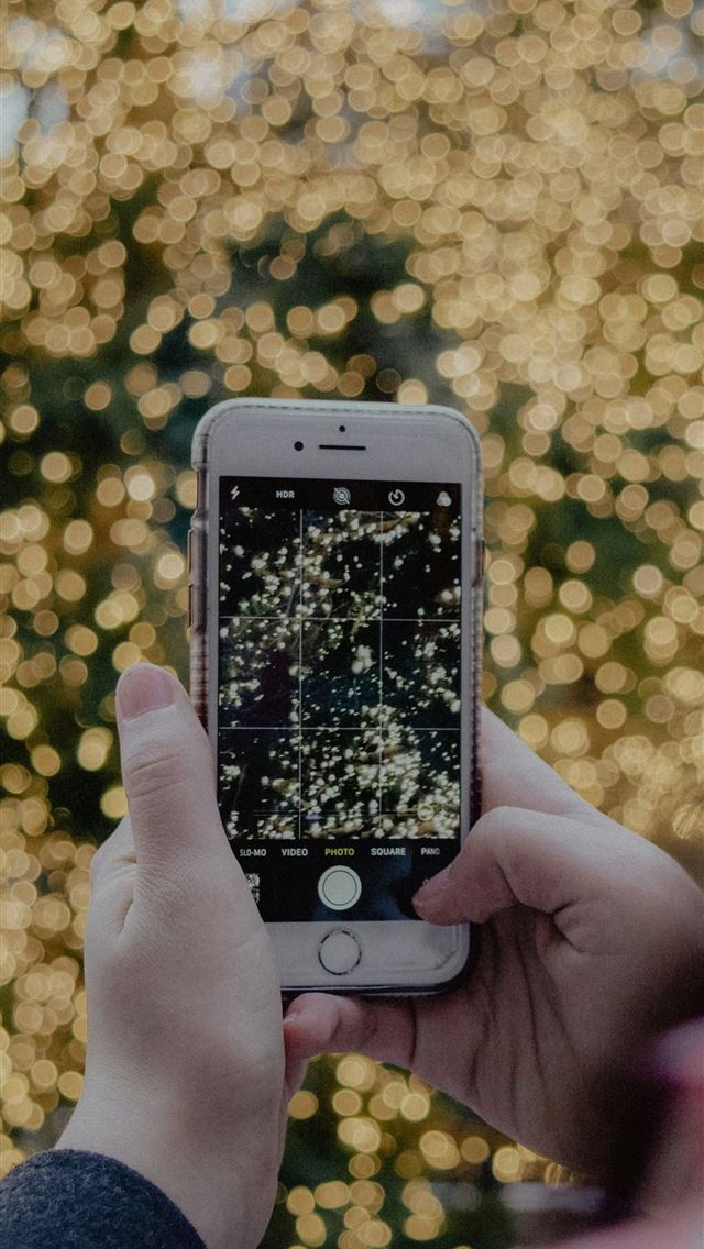 1290x2796 person holding iPhone -  iPhone Wallpaper