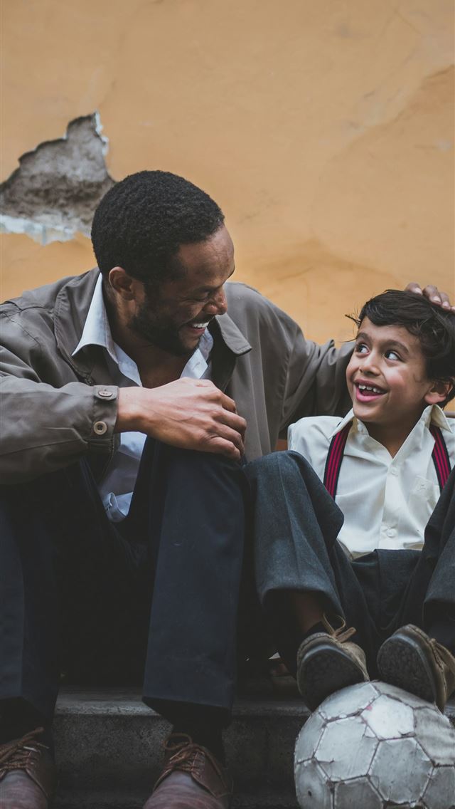 1290x2796 man holding boy's head -  iPhone Wallpaper