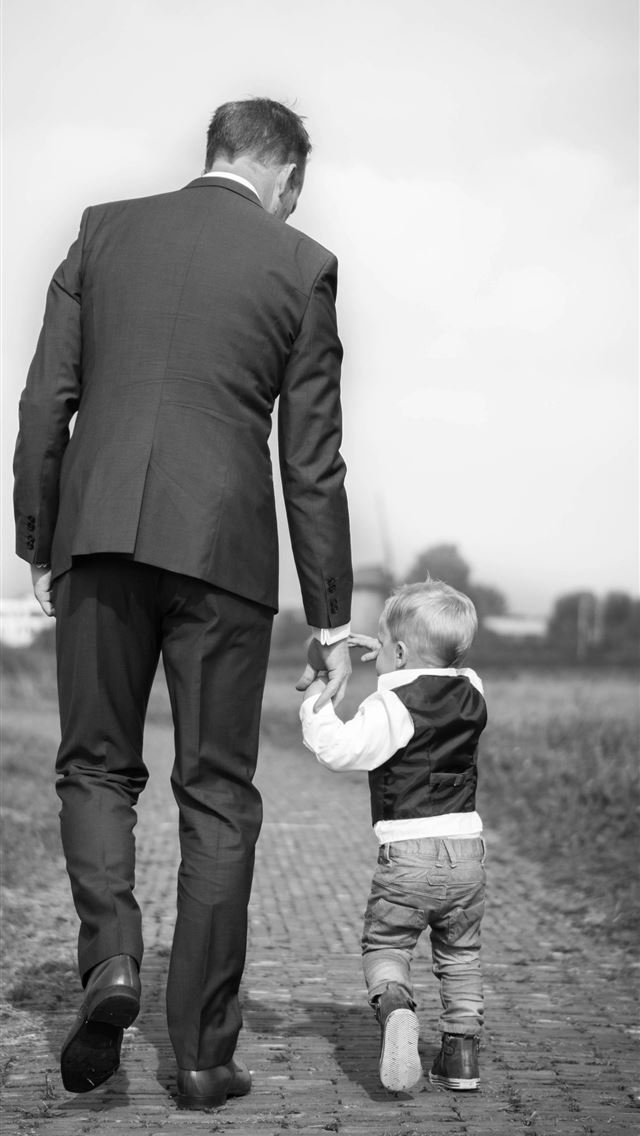 1290x2796 man walking holding boy -  iPhone Wallpaper