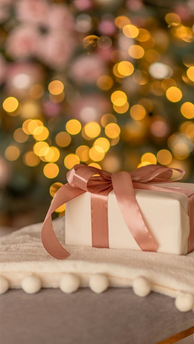 1290x2796 a present box sitting on a table with a christmas ... -  iPhone Wallpaper