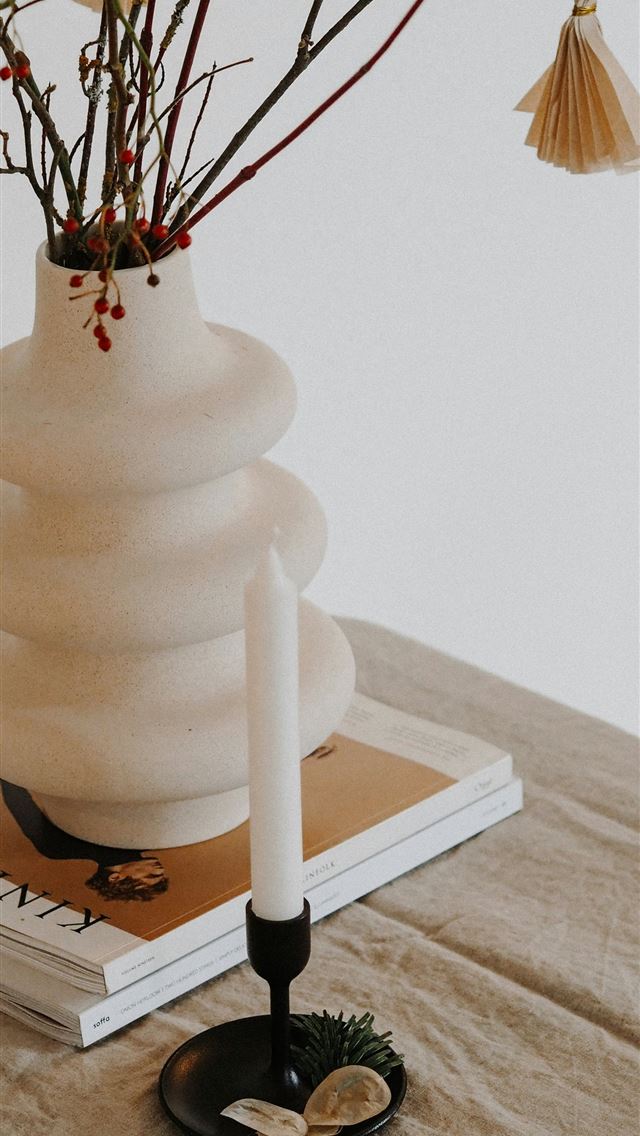 1290x2796 white ceramic vase on white book -  iPhone Wallpaper