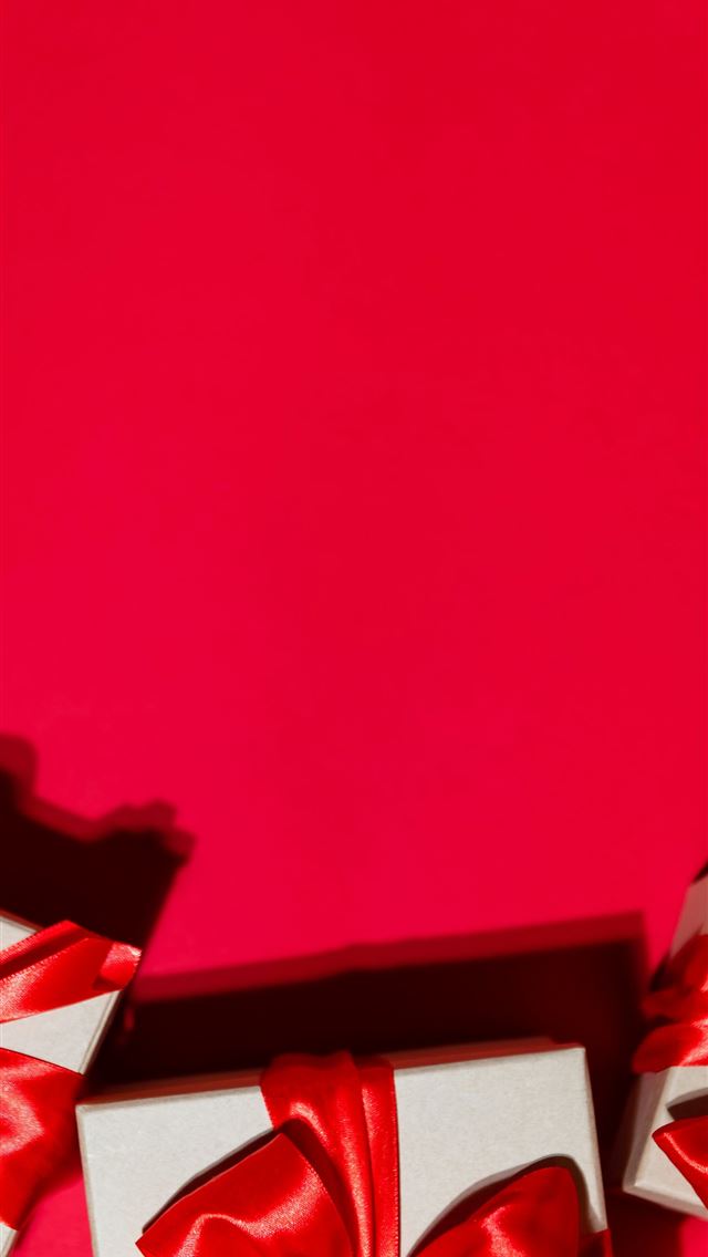 1290x2796 two white boxes with red bows on a red background -  iPhone Wallpaper
