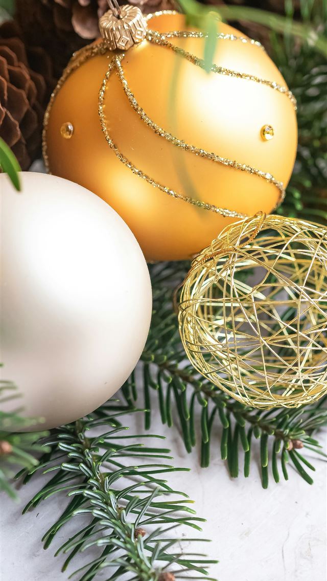 1290x2796 a close up of christmas ornaments on a table -  iPhone Wallpaper