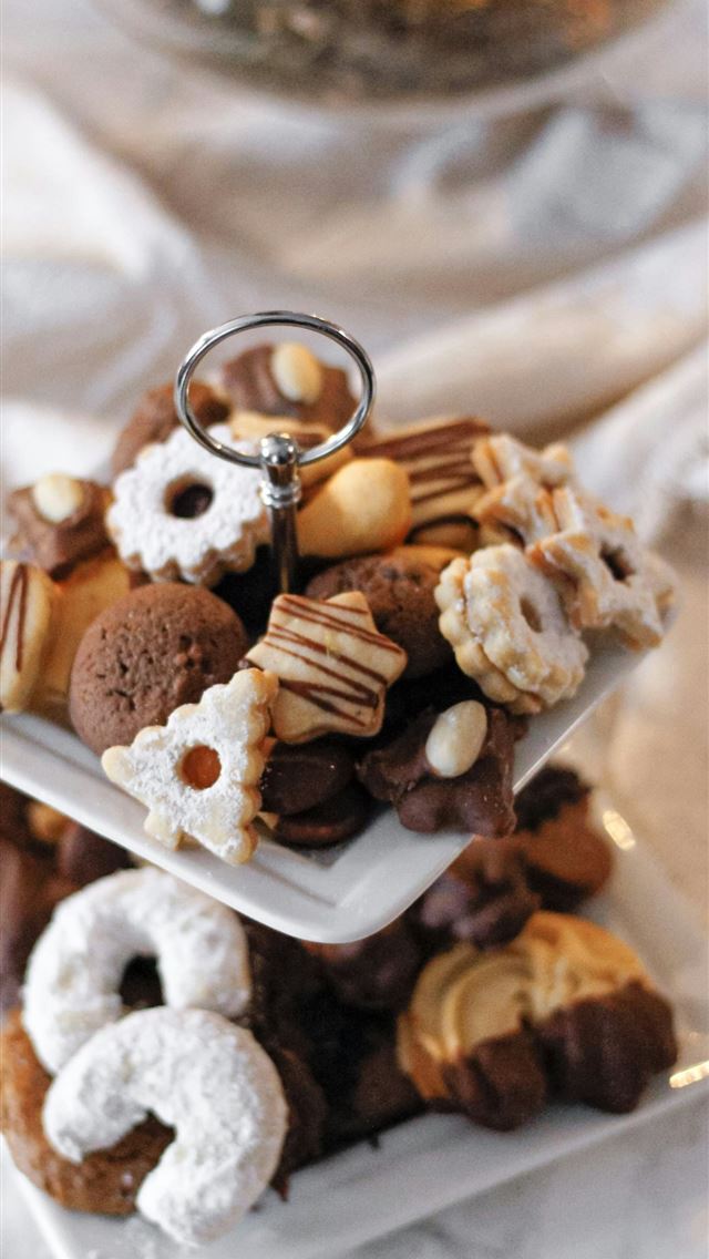 1242x2688 a stack of desserts on a plate on a table -  iPhone Wallpaper