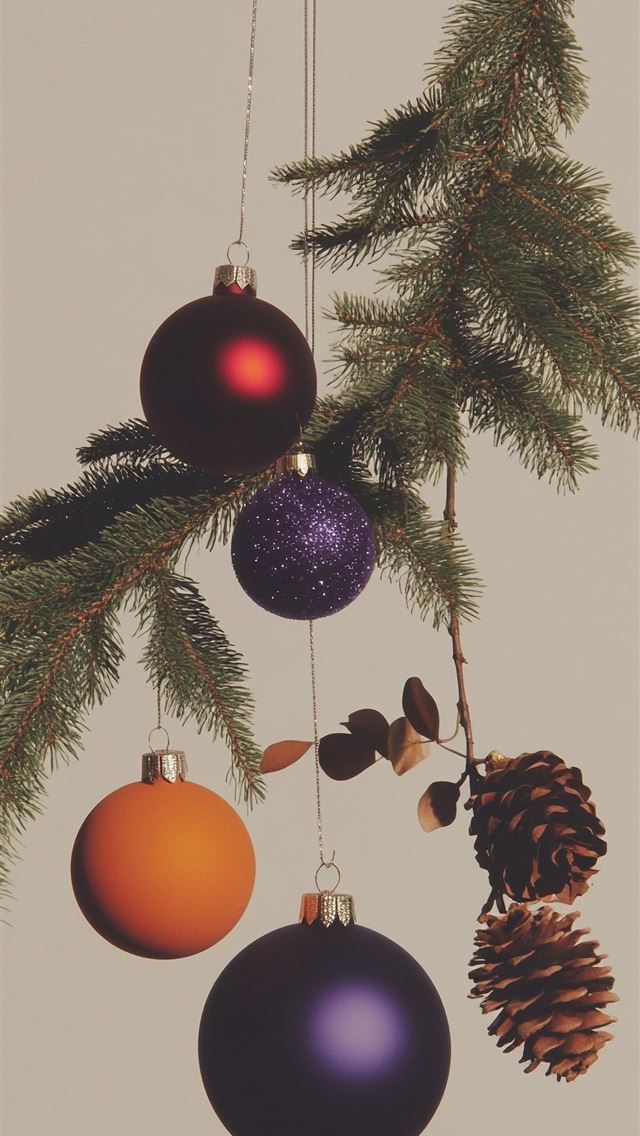 1290x2796 A christmas tree with ornaments hanging from it -  iPhone Wallpaper