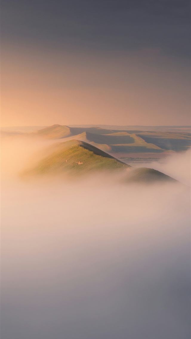 1290x2796 Hills peek above a sea of clouds  -  iPhone Wallpaper