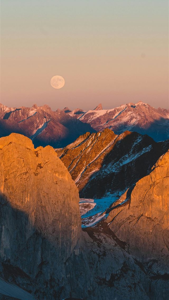 1290x2796 Mountains and the moon illuminate a beautiful land... -  iPhone Wallpaper