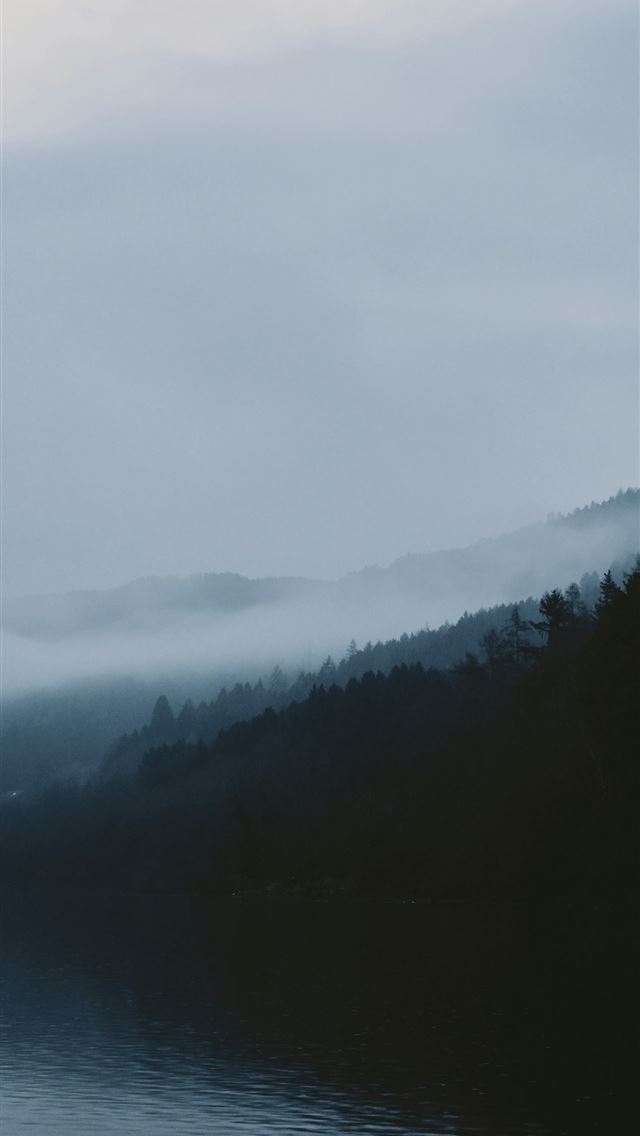 1290x2796 Foggy mountains meet a calm body of water  -  iPhone Wallpaper