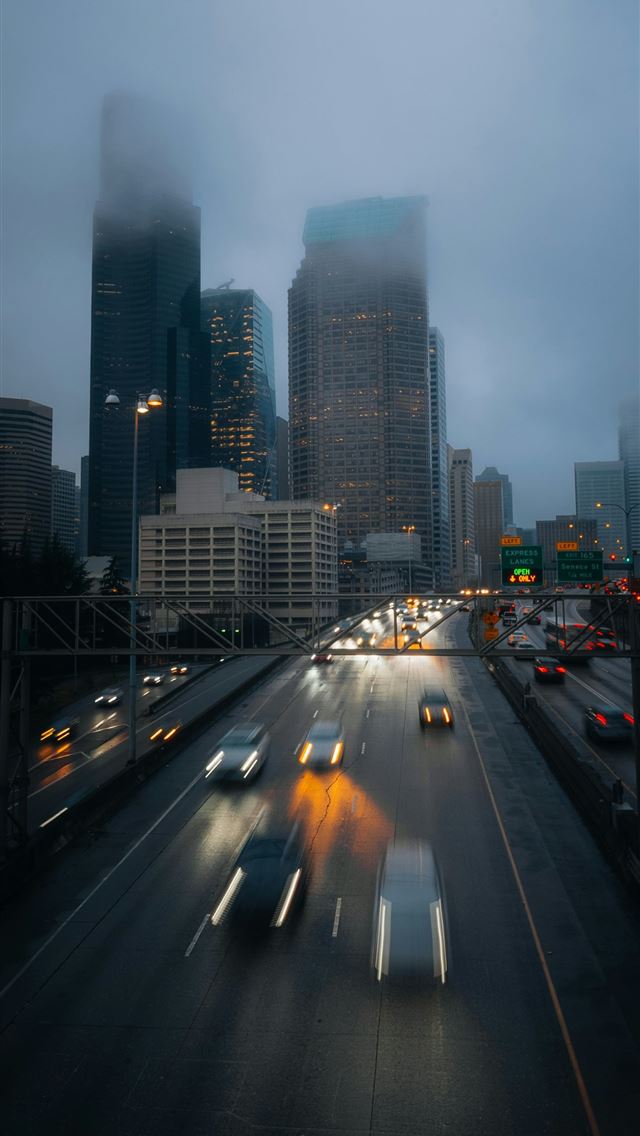 1290x2796 A city street filled with lots of traffic -  iPhone Wallpaper