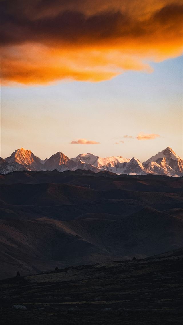 1290x2796 A view of a mountain range at sunset -  iPhone Wallpaper