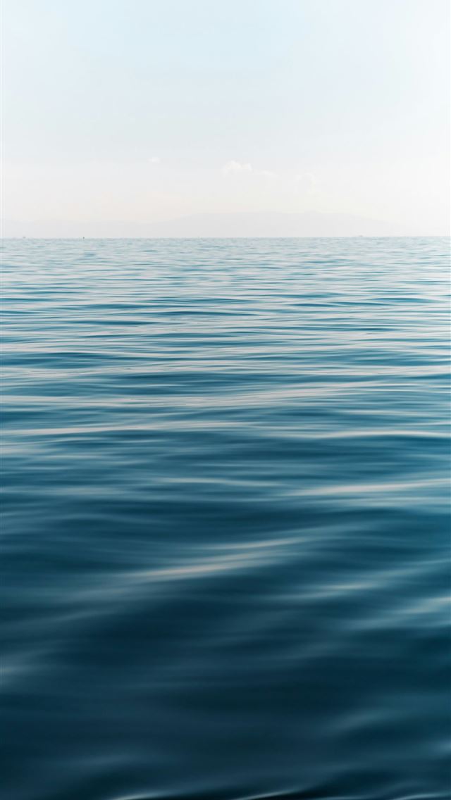 1290x2796 A large body of water with a sky in the background -  iPhone Wallpaper