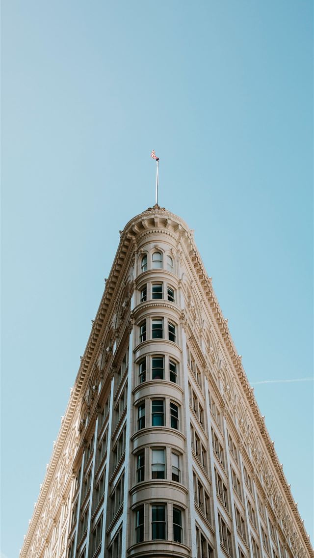 1290x2796 An old building with a triangle shape is shown  -  iPhone Wallpaper