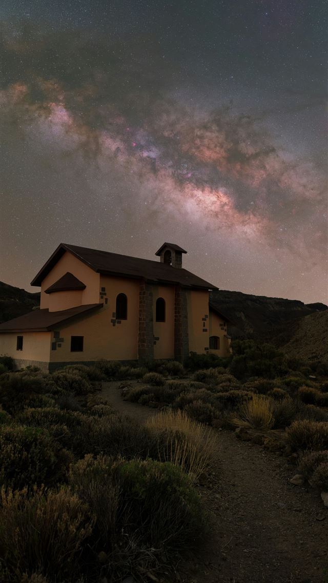 1290x2796 A church stands under a starry milky way sky  -  iPhone Wallpaper