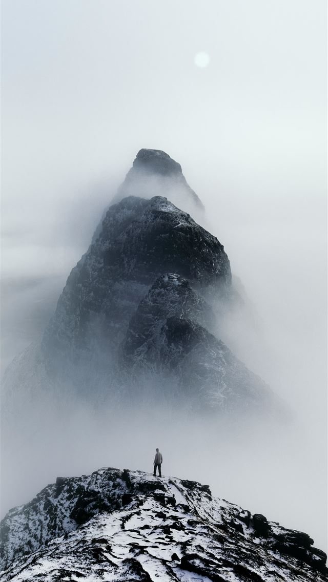 1290x2796 A person standing on top of a snow covered mountai... -  iPhone Wallpaper