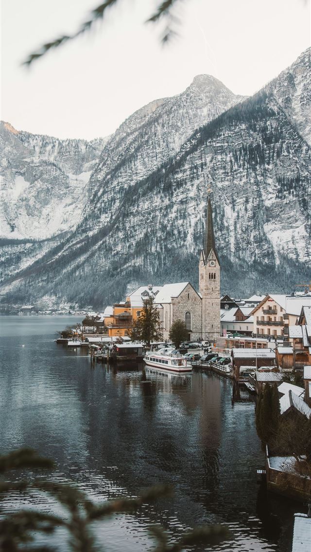 1290x2796 A small town on a lake surrounded by mountains -  iPhone Wallpaper
